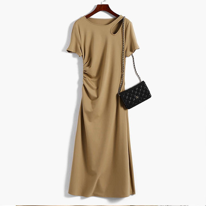 Women's maxi dress with asymmetric cut-out, side gathering, and flowing A-line.