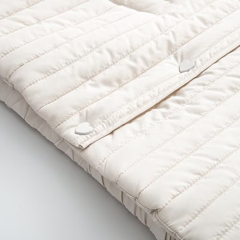 Women's short quilted jacket with vertical quilting, shirt collar and heart button placket Mune Fashion