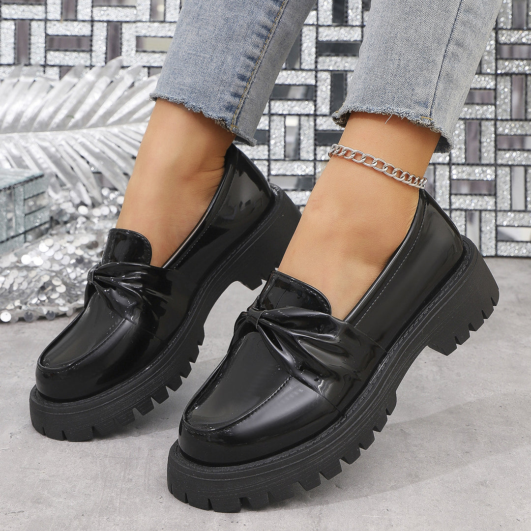 Women’s shiny platform loafers with oversized bow appliqué and profiled rubber sole Mune Fashion