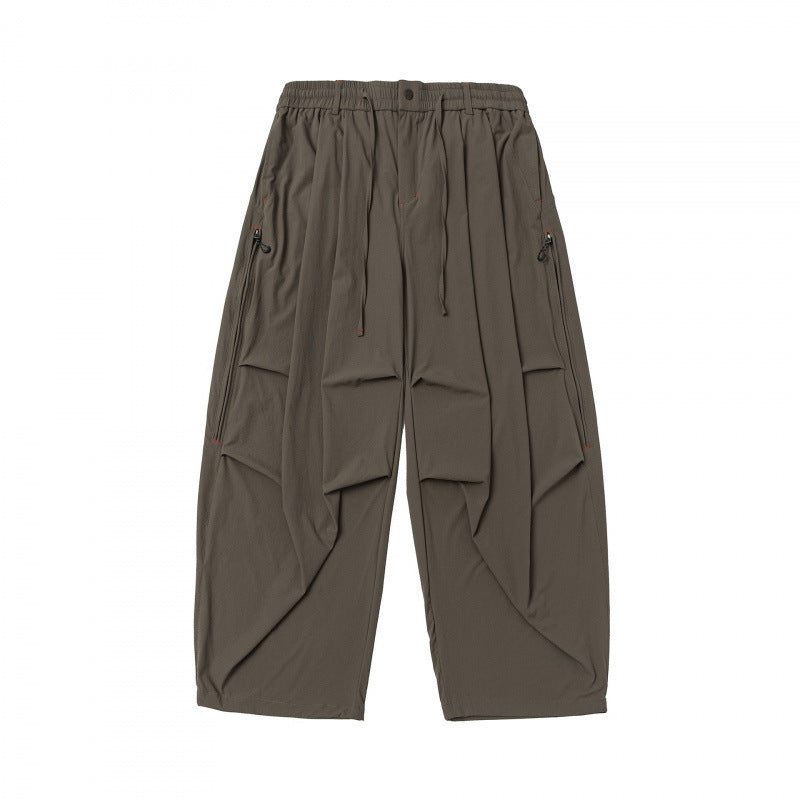 Unisex Loose-fitting technical cargo pants with elastic waistband, drawstring, and zip pockets Mune Fashion