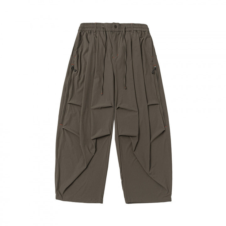Unisex Loose-fitting technical cargo pants with elastic waistband, drawstring, and zip pockets Mune Fashion