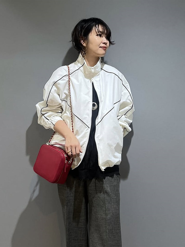 Women’s short bomber-style jacket with sculptural seam design and high stand-up collar Mune Fashion
