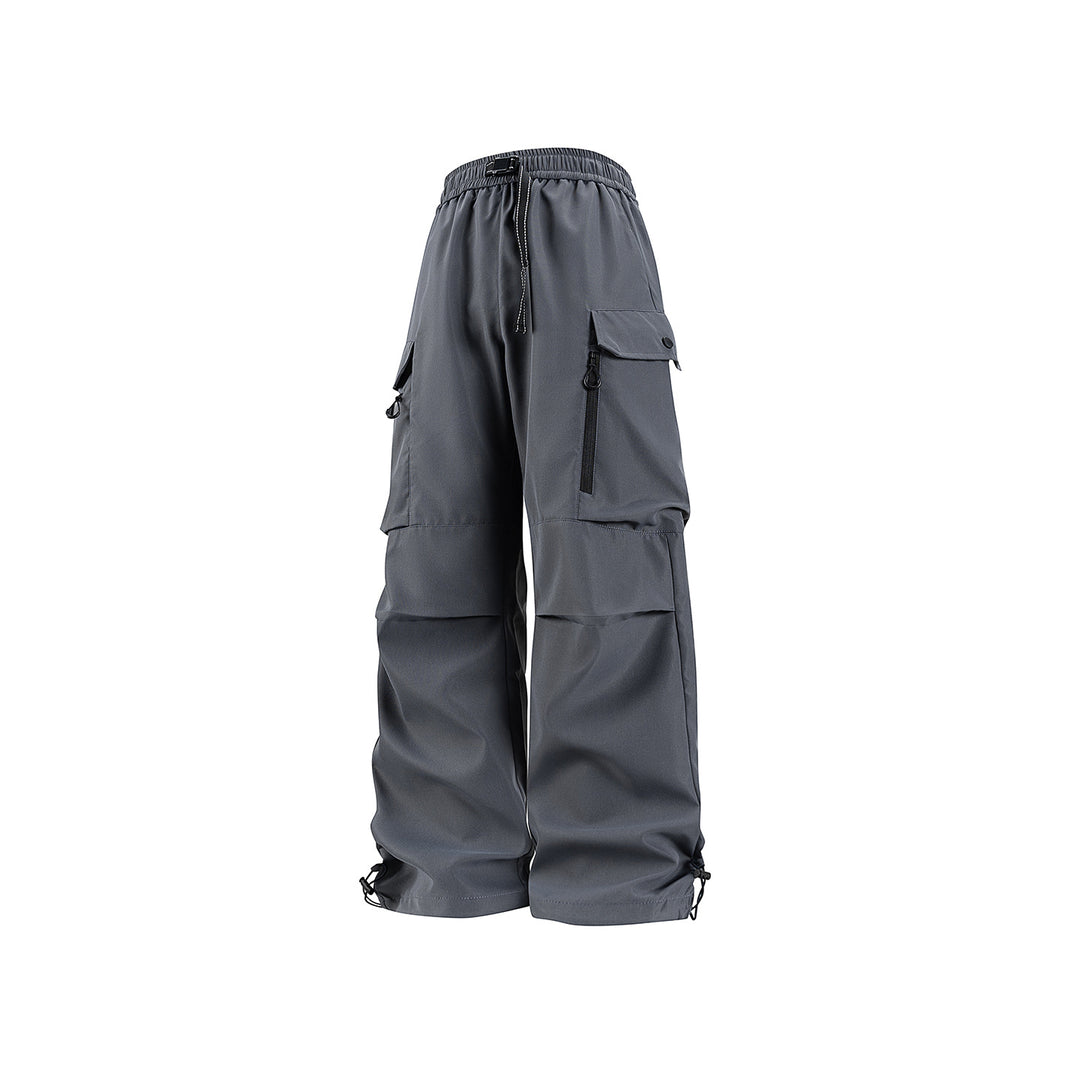 Unisex Wide technical cargo pants with multi-function pockets, drawstring and adjustable leg hems Drune