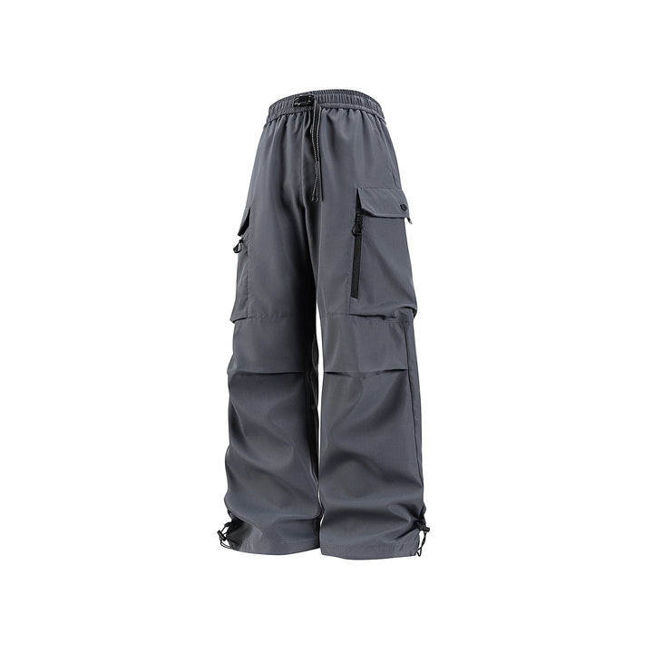 Unisex Wide technical cargo pants with multi-function pockets, drawstring and adjustable leg hems Drune