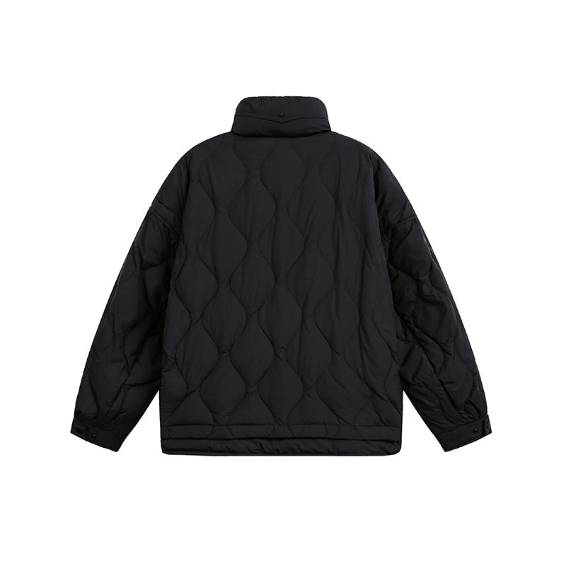 Women's oversized quilted jacket with stand-up collar, wave quilting, and drawstring hood