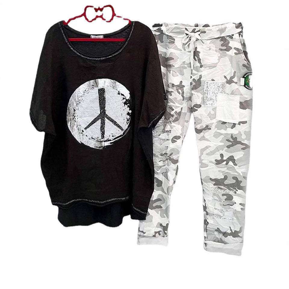 Women’s casual leisure two-piece with wide-cut linen look shirt, peace symbol and camouflage jog pants with patch details Mune Fashion