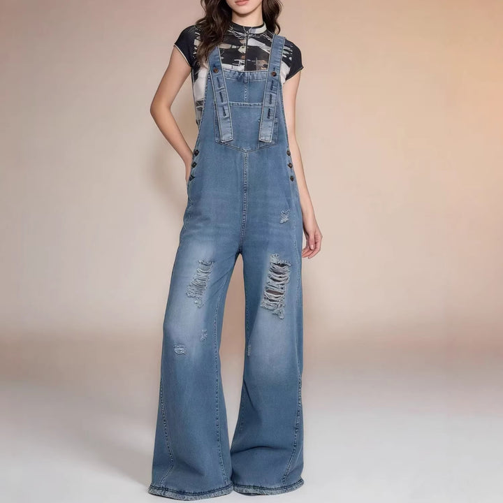 Women's modern baggy overalls made of pigment-dyed stretch denim with adjustable straps and visible rips Mune Fashion