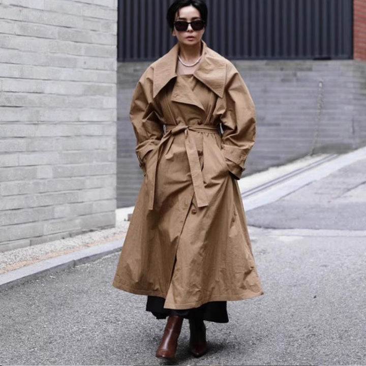Women's Maxi Length Trench Coat with Oversized Shoulder Yoke, Waist Belt, and Voluminous Sleeves Mune Fashion