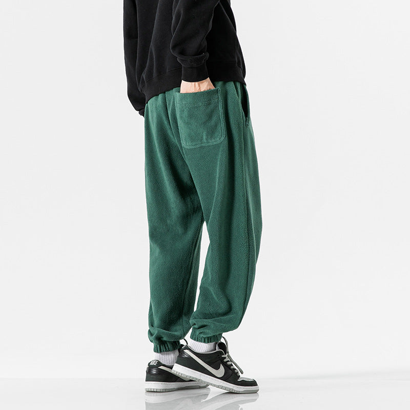 Men's wide-cut fleece jogging pants with elastic cuffs and side pockets Mune Fashion