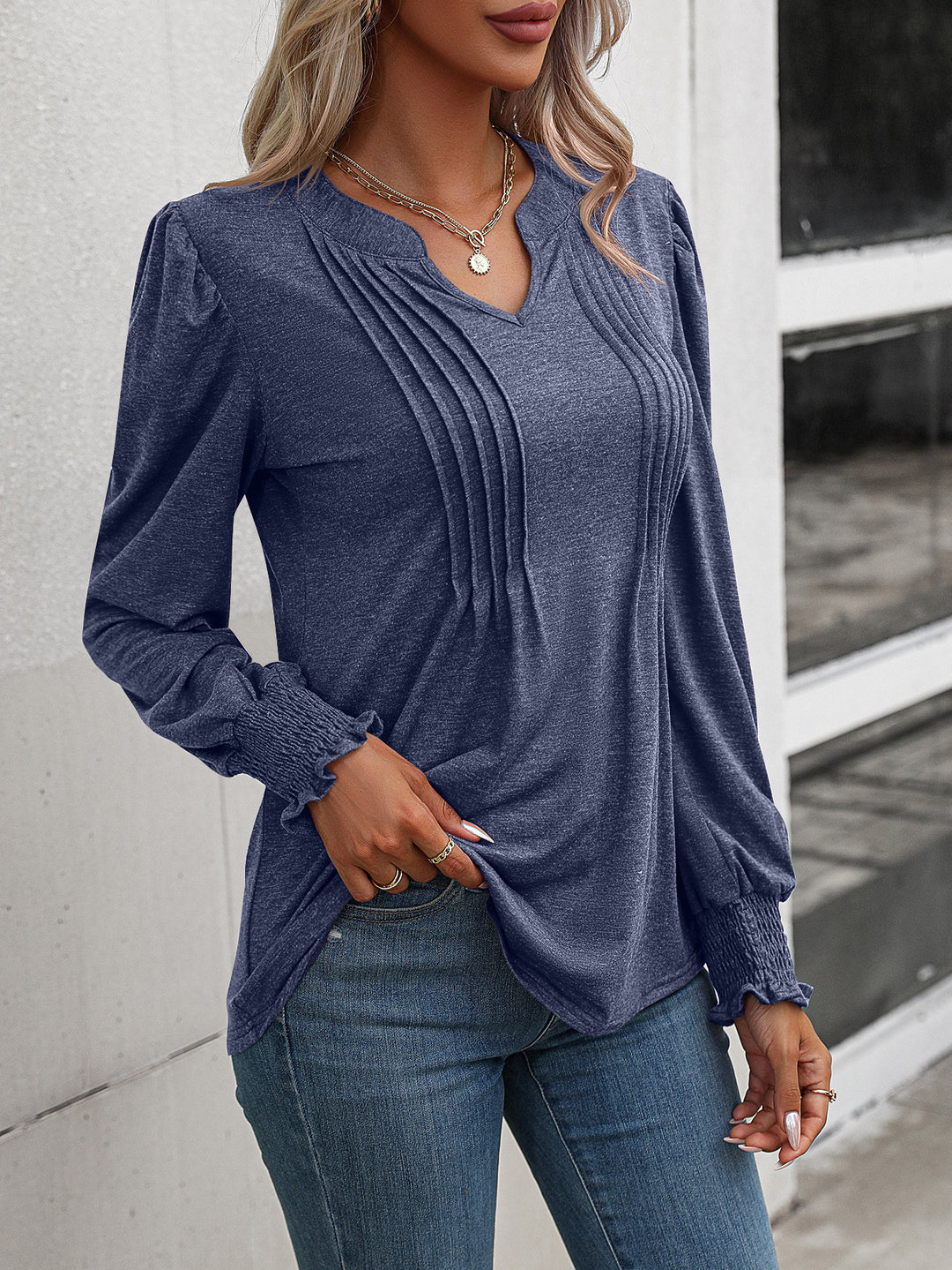Women's long sleeve shirt with V-neckline, decorative inverted pleats at the front and elastic smocked cuffs Mune Fashion