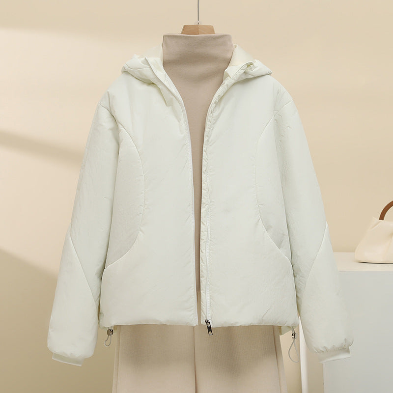 Women's quilted hooded jacket with short boxy cut, adjustable hem, and warming padding Mune Fashion