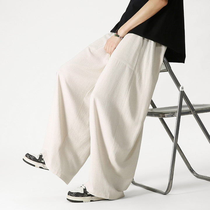 Men's loose-fitting lounge pants with tassel cord, elastic waistband, and patch pockets Mune Fashion