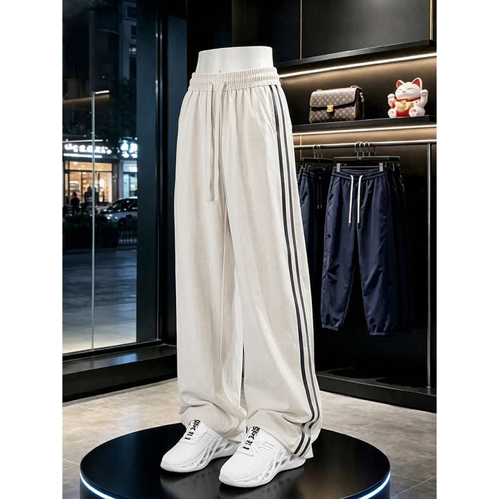 Women's sporty leisure pants with high waistband and side stripes Mune Fashion