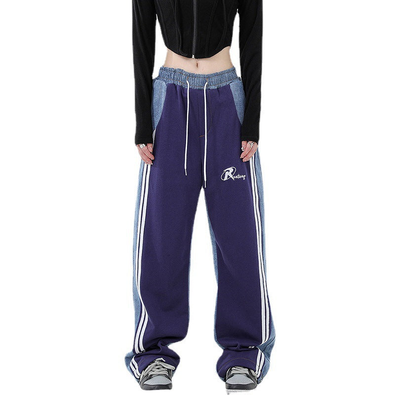 Ladies loose-fitting jogging pants with denim inserts, elastic waistband, and side contrast stripes Mune Fashion