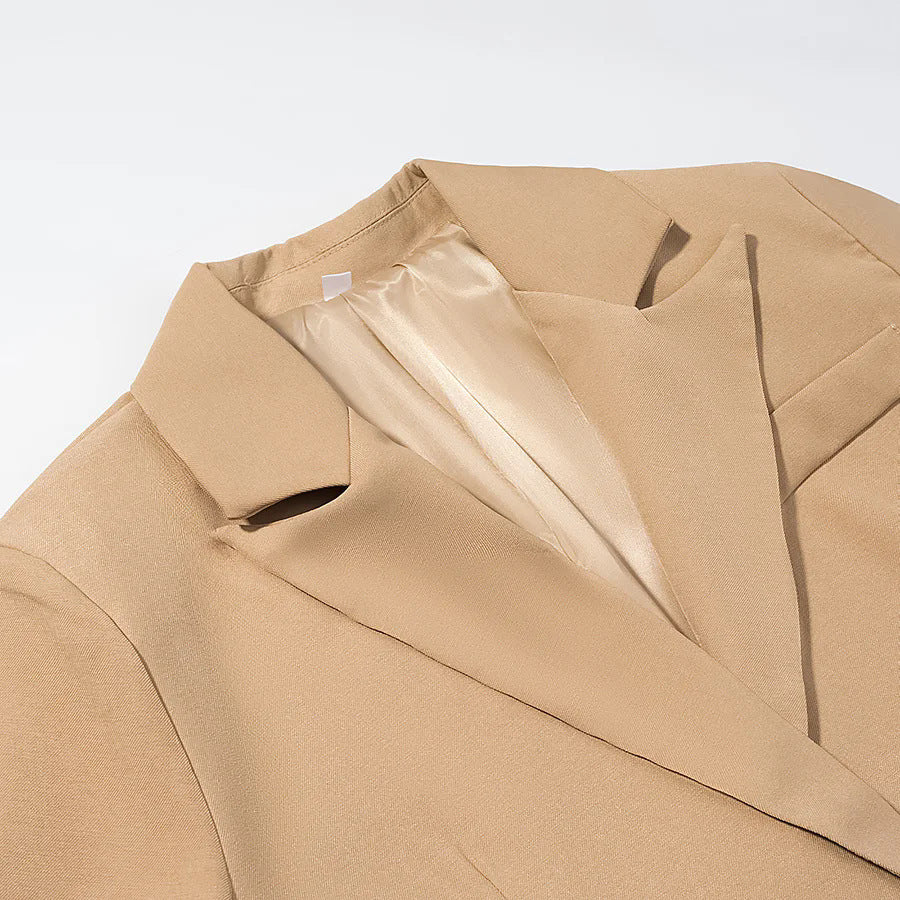 Women's longer tailored wool blend coat with lapel collar, patch pockets, and full button placket Mune Fashion