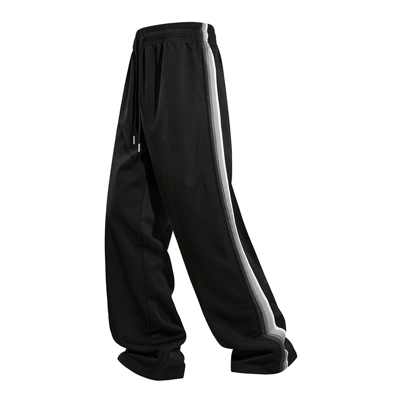 Men's loose baggy training pants with drawstring waistband, elastic comfort waistband, and side stripe detail Mune Fashion