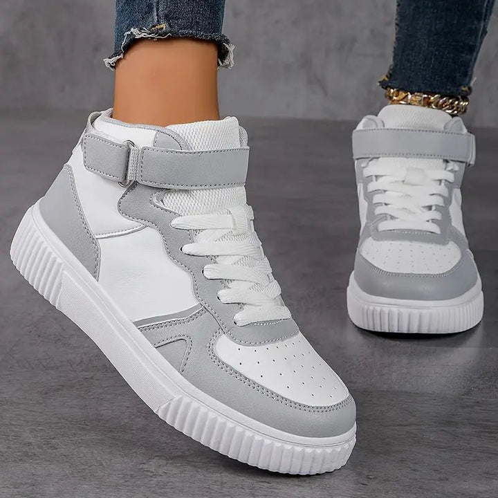 Women’s ankle-high polyurethane leather casual shoe with Velcro cuff, perforated toe cap, and textured rubber sole Mune Fashion