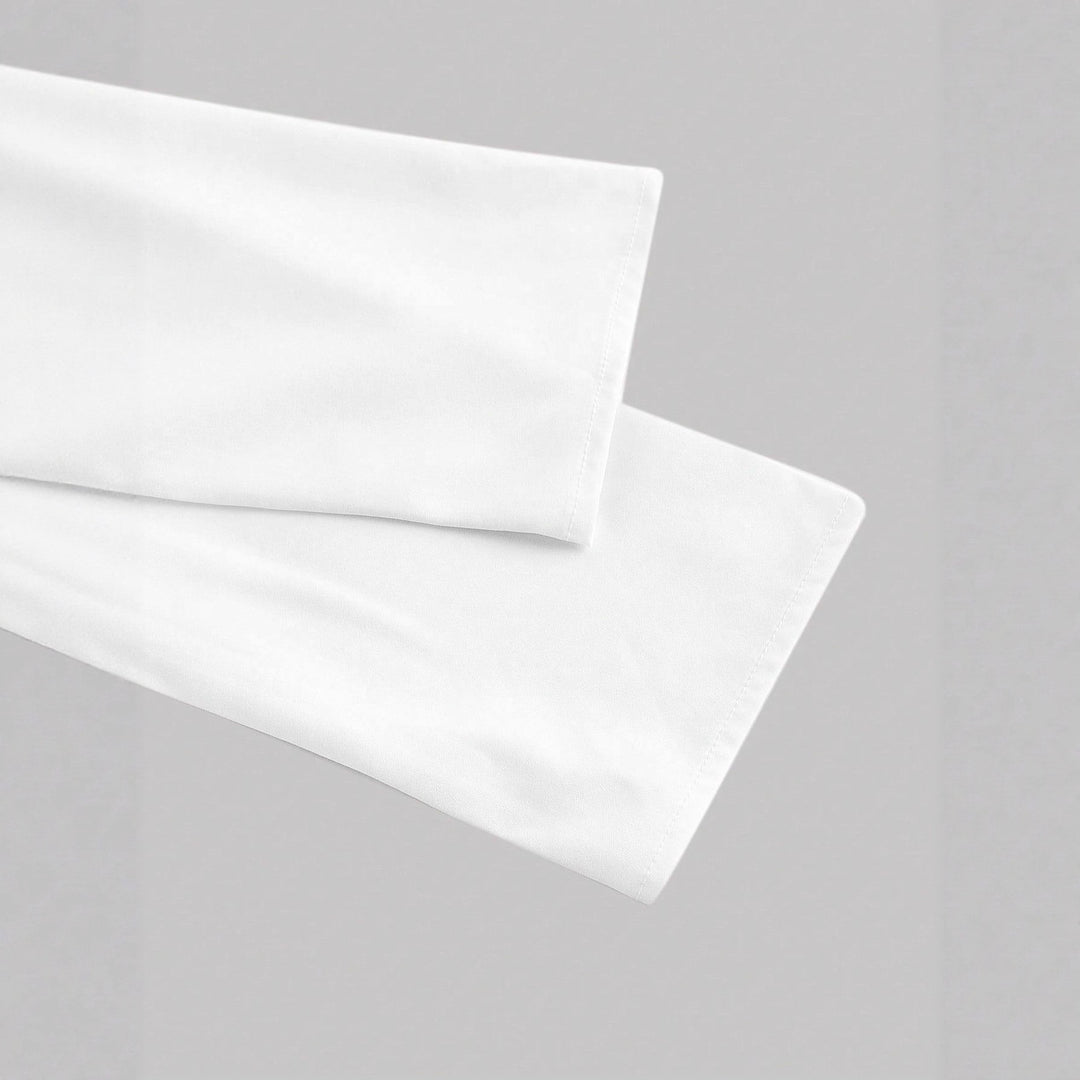 Women's wrap blouse with tailored draping and asymmetrical button placket Mune Fashion