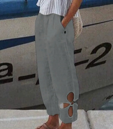Women's ankle-length culotte pants with elastic waistband, side pockets, and floral hem cutout Mune Fashion