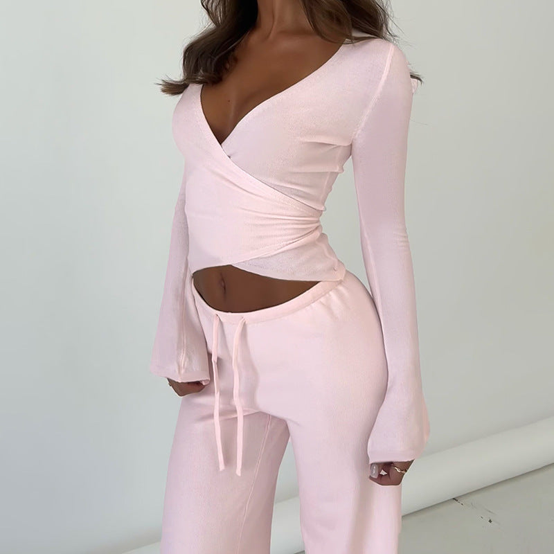 Women's wrap cropped top with deep V-neck, fitted wrap shape, and long bell sleeves Mune Fashion
