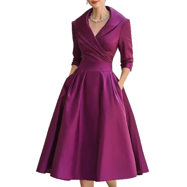Women's elegant midi dress with wrap top, three-quarter sleeves, and side pockets Mune Fashion