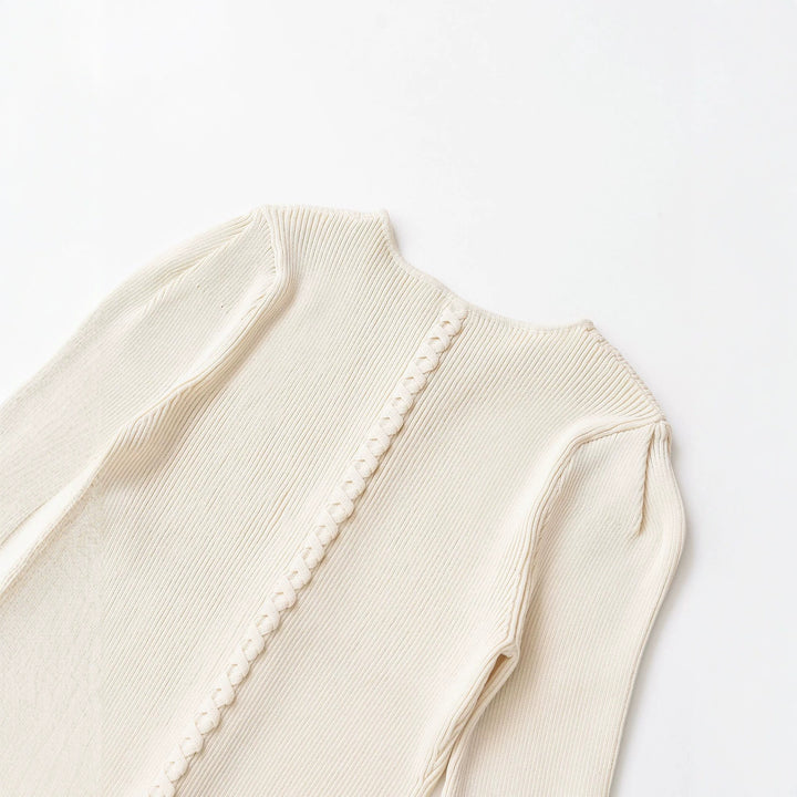 Women's fine knit cardigan with full button placket, tailored ribbed structure, and curved hem Mune Fashion