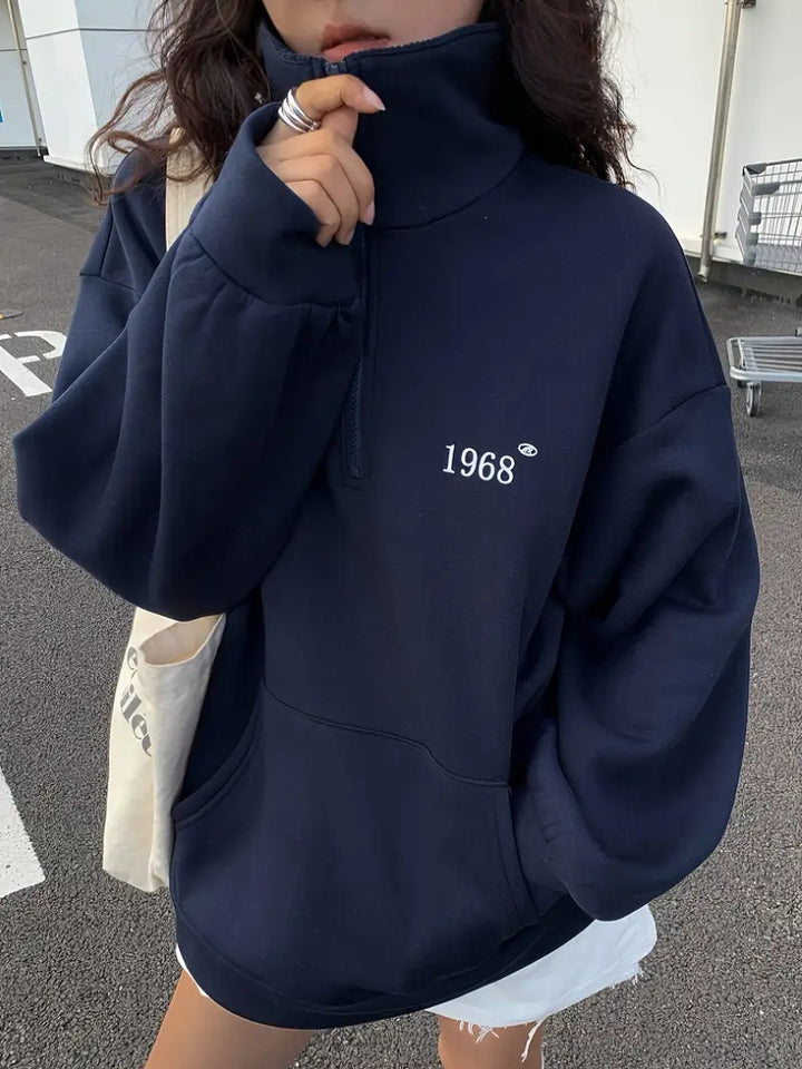 Women's oversized half-zip sweatshirt with high collar, kangaroo pocket, and casual oversized fit Mune Fashion