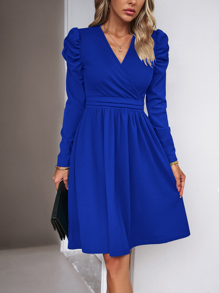 Women's wrap dress with V-neck, gathered puff sleeves, and fitted pleated skirt Drune