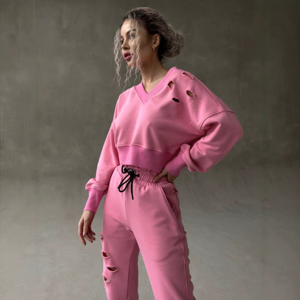 Ladies short-cut sweat set with V-neck, ruffled waistband high-waist joggers and distressed details Mune Fashion
