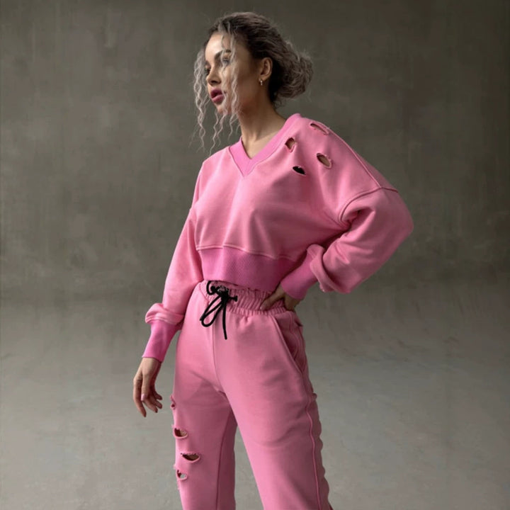 Ladies short-cut sweat set with V-neck, ruffled waistband high-waist joggers and distressed details Mune Fashion