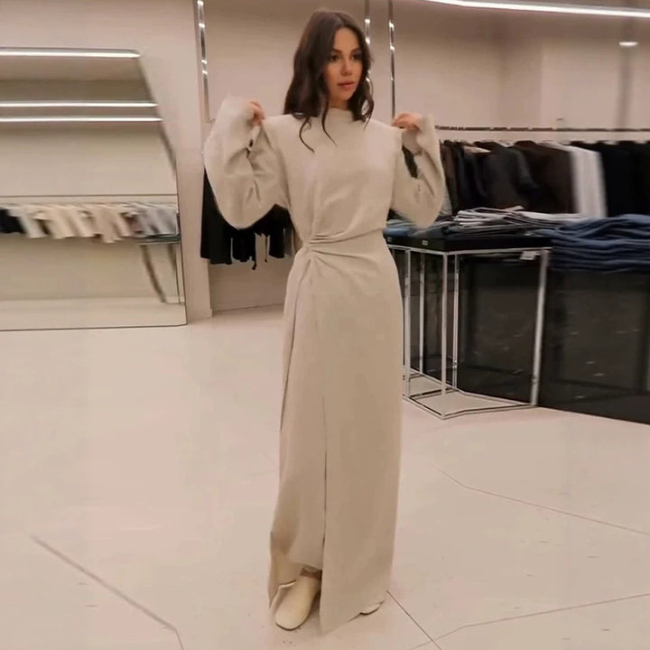 Women’s maxi dress with tailored silhouette, flared skirt and striking shoulders Mune Fashion
