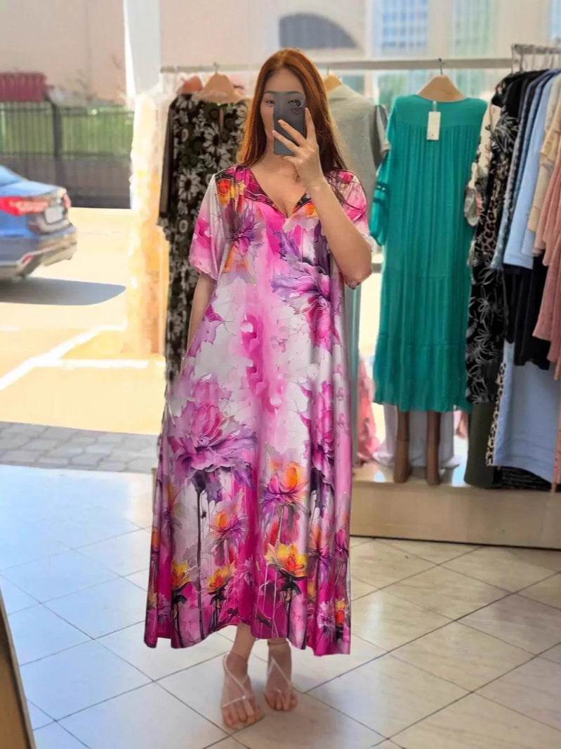 Women flowing maxi kaftan dress with V-neck and large watercolor floral print Mune Fashion