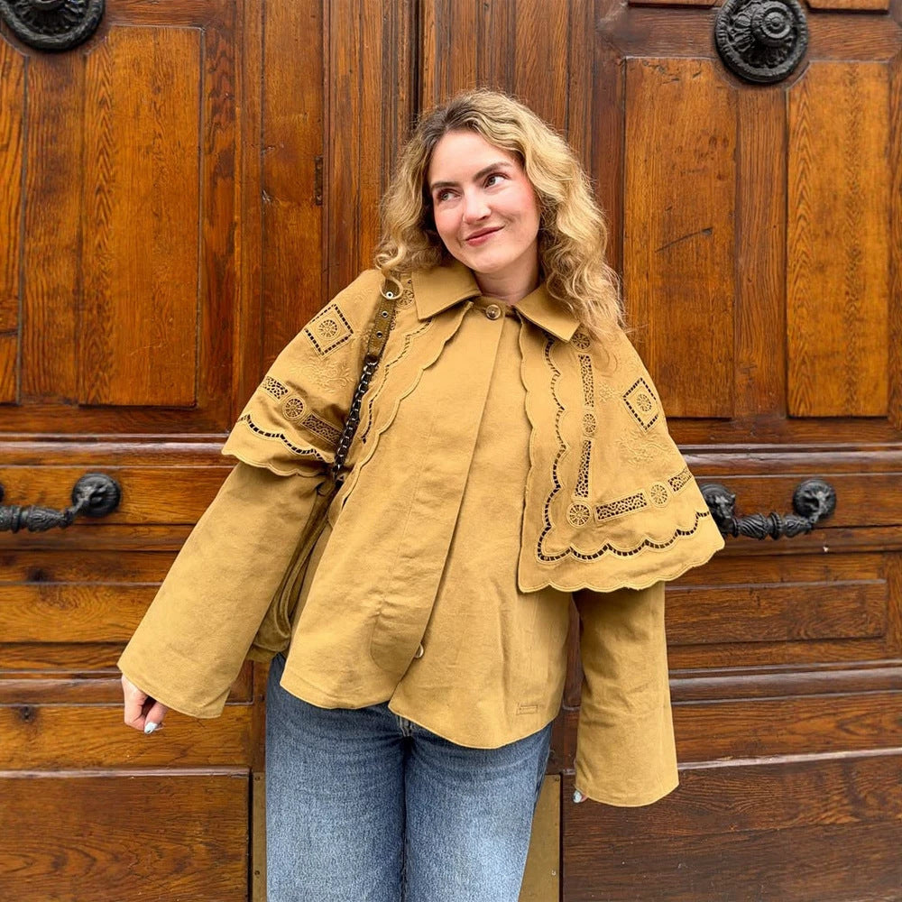 Women's short jacket with embroidered cape, eyelet embroidery and curved hem Mune Fashion