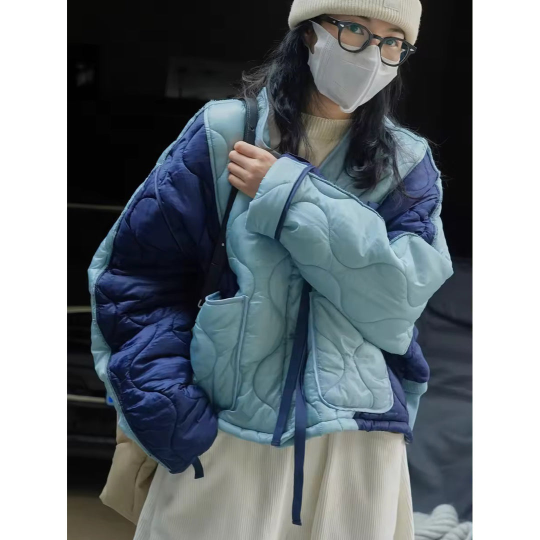 Women's Padded Oversized Quilted Jacket with Contrasting Sleeves and Button Placket Mune Fashion