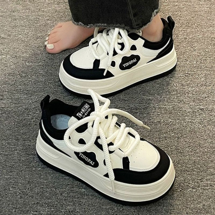 Women's lace-up sneakers with modern design elements and cushioning sole Mune Fashion