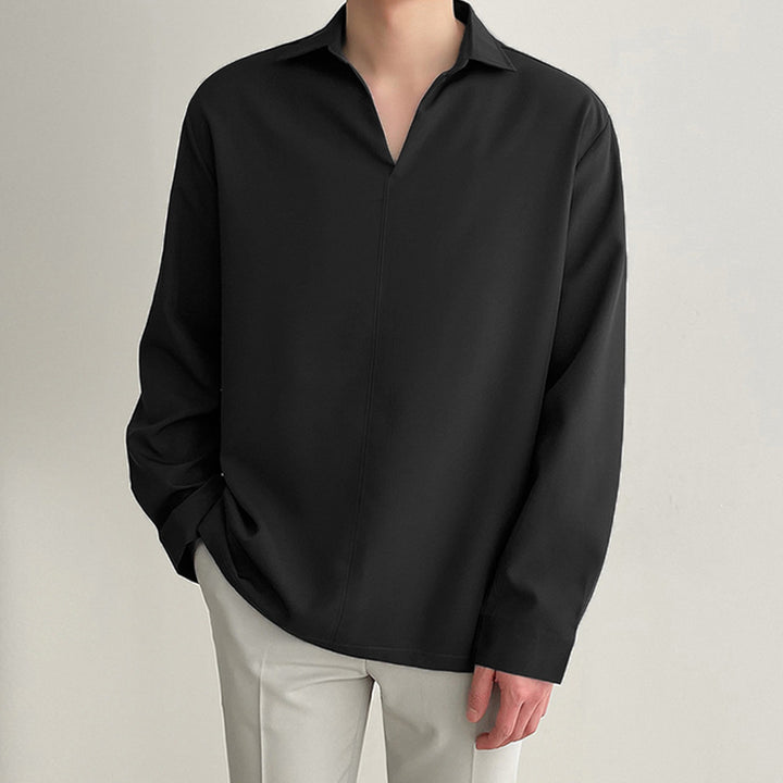 Women's loosely cut tunic blouse with deep V-neck, concealed button placket, and dropped shoulders Mune Fashion