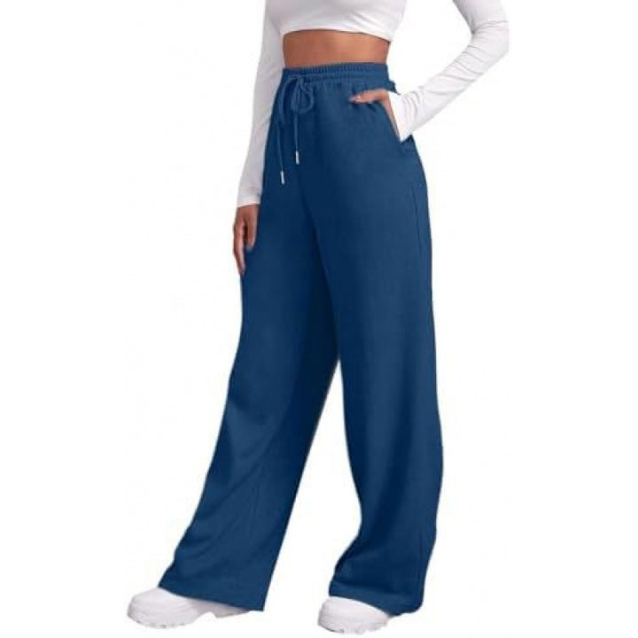Women's flowing high-waist palazzo lounge pants made of lightweight jersey with elastic waistband and practical side pockets Mune Fashion