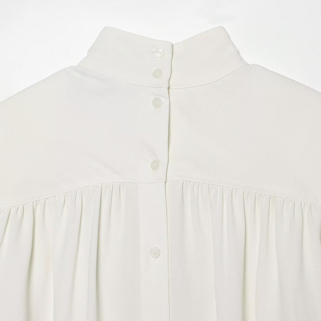 Ladies' blouse with high roll neck, gathered front and bow sleeves Mune Fashion