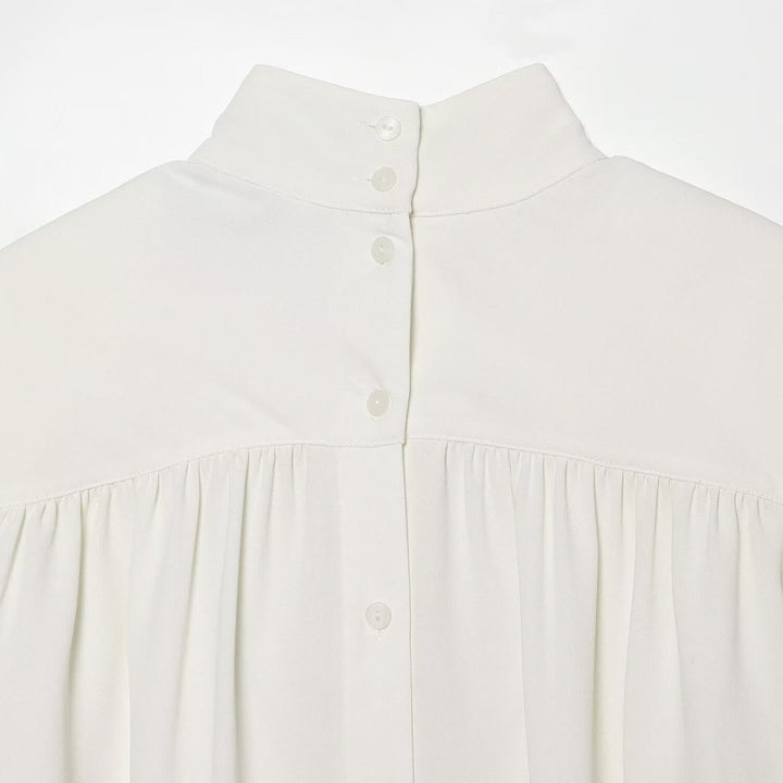 Ladies' blouse with high roll neck, gathered front and bow sleeves Mune Fashion