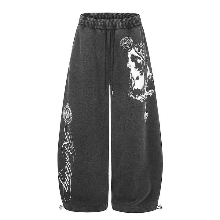 Women's extra-wide palazzo harem pants made of sweatshirt fabric with a high comfort waistband, drawstring, and large graphic print Mune Fashion