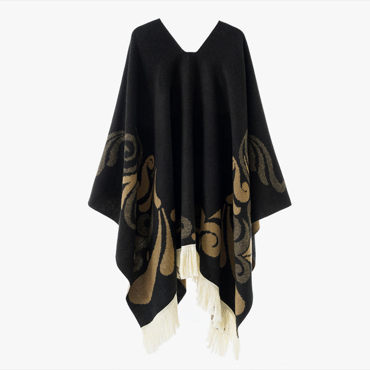Women's wool blend poncho in cape style with V-neck, contrasting ornament jacquard and fringes.