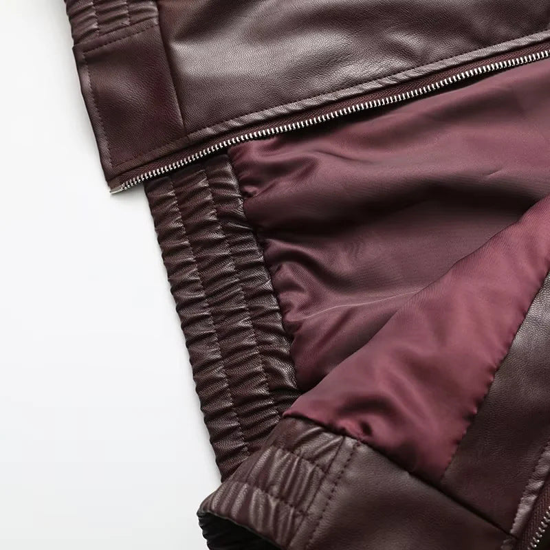 Women's fitted faux leather bomber jacket with large lapel collar, full-length zipper and elastic waistband Mune Fashion