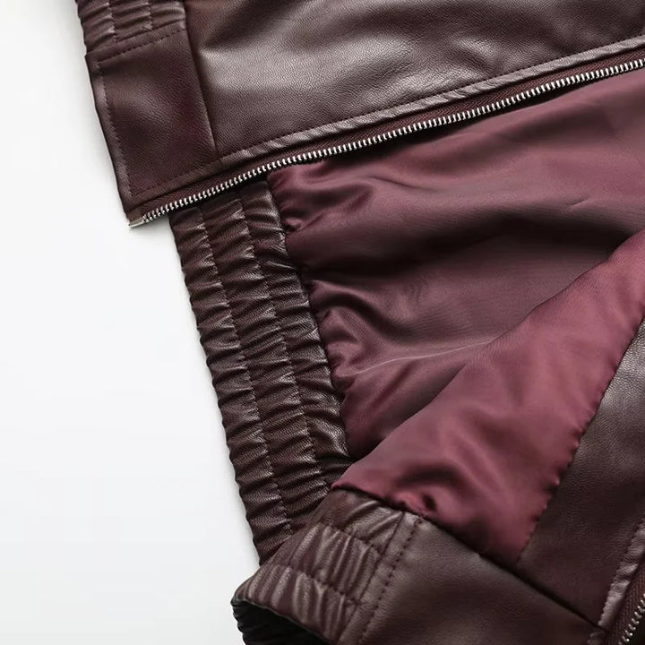 Women's fitted faux leather bomber jacket with large lapel collar, full-length zipper and elastic waistband Mune Fashion