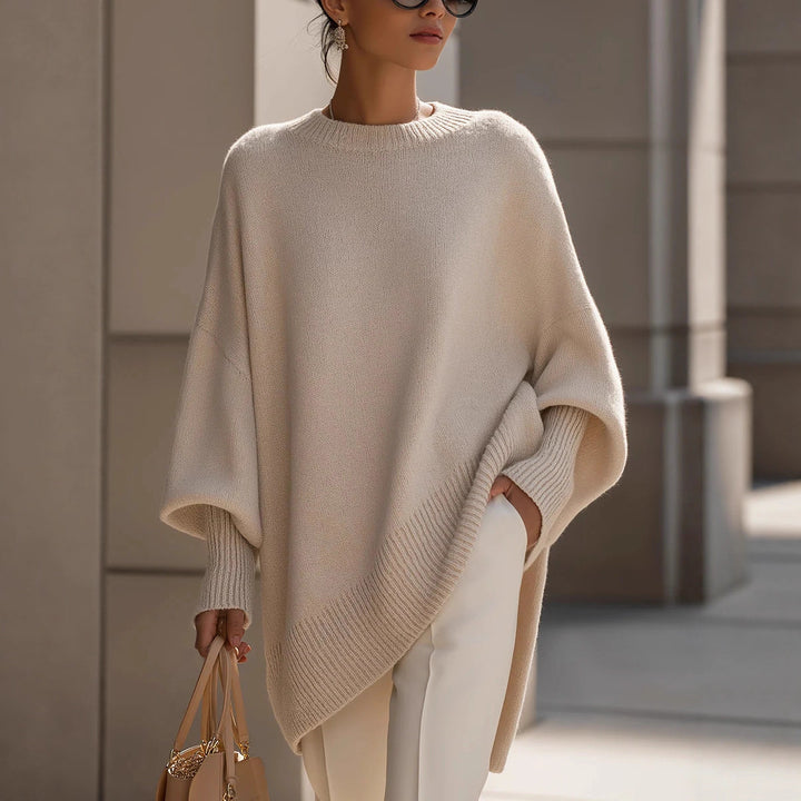 Women's oversized knit poncho with asymmetrical hem and ribbed sleeves Mune Fashion