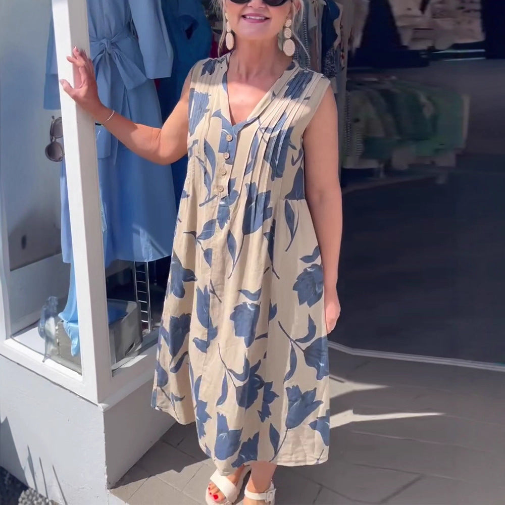 Women's sleeveless A-line midi dress with V-neck, bust pleats, button placket, and large floral print Mune Fashion