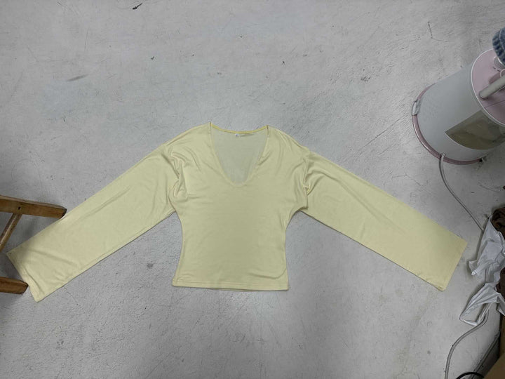 Women's tailored long sleeve cropped shirt with V-neck, dropped shoulder, and soft jersey quality Mune Fashion