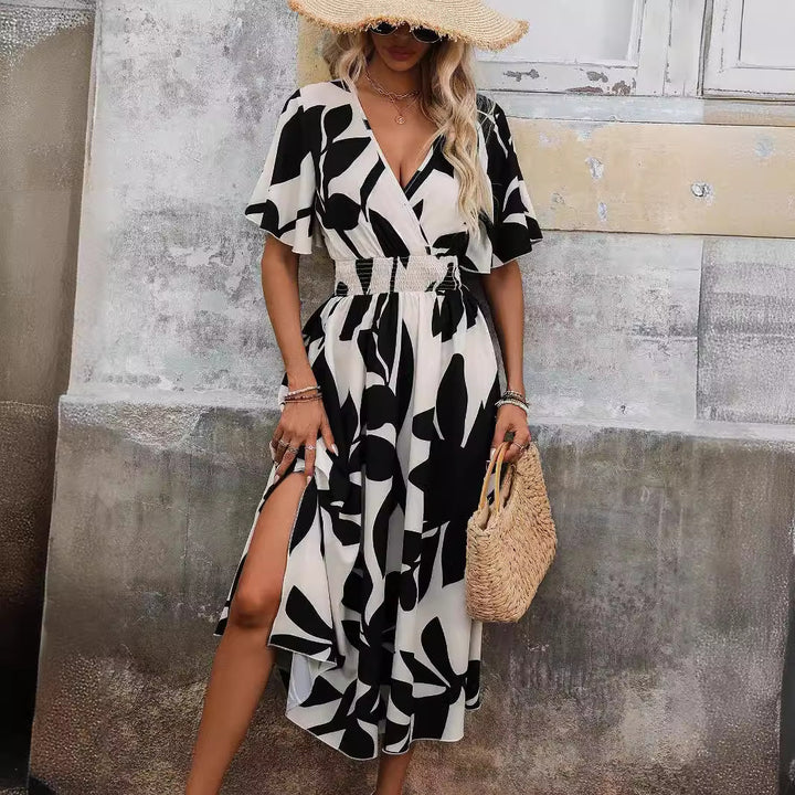 Women’s wrap midi dress with elastic smocked waistband, wide batwing sleeves, and high leg slit Mune Fashion