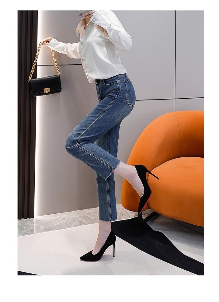 Ladies elegant pointed suede pumps with contrasting red sole and narrow stiletto heel
