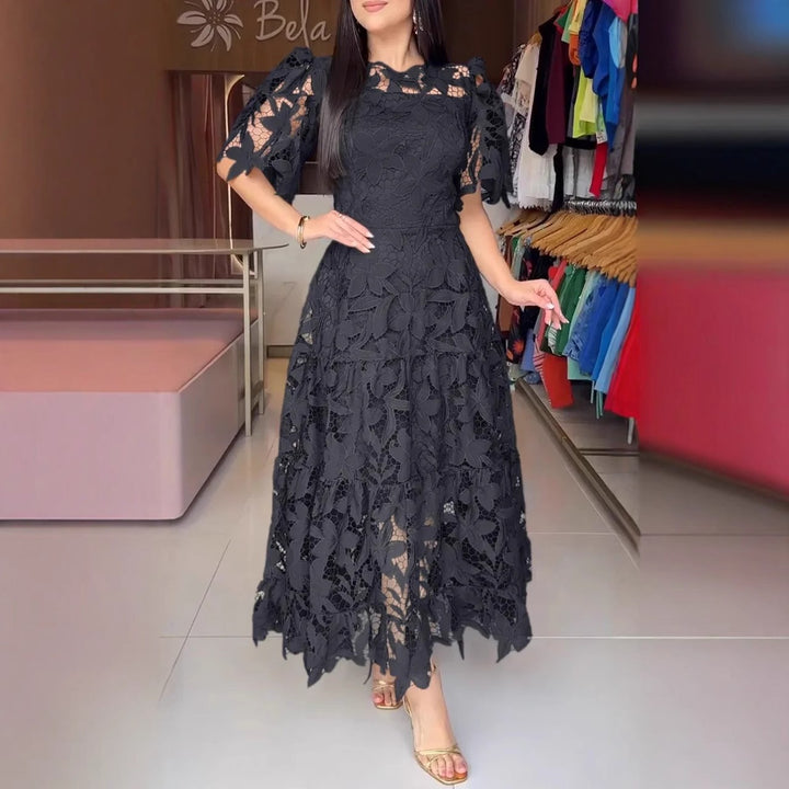 Women's maxi dress made of floral guipure lace with a fitted silhouette and tiered hem Mune Fashion