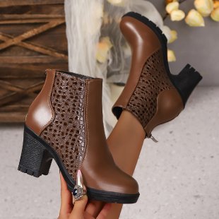 Ladies’ elegant ankle boots with braided cut-out upper material, side zipper, and comfortable block heel Mune Fashion
